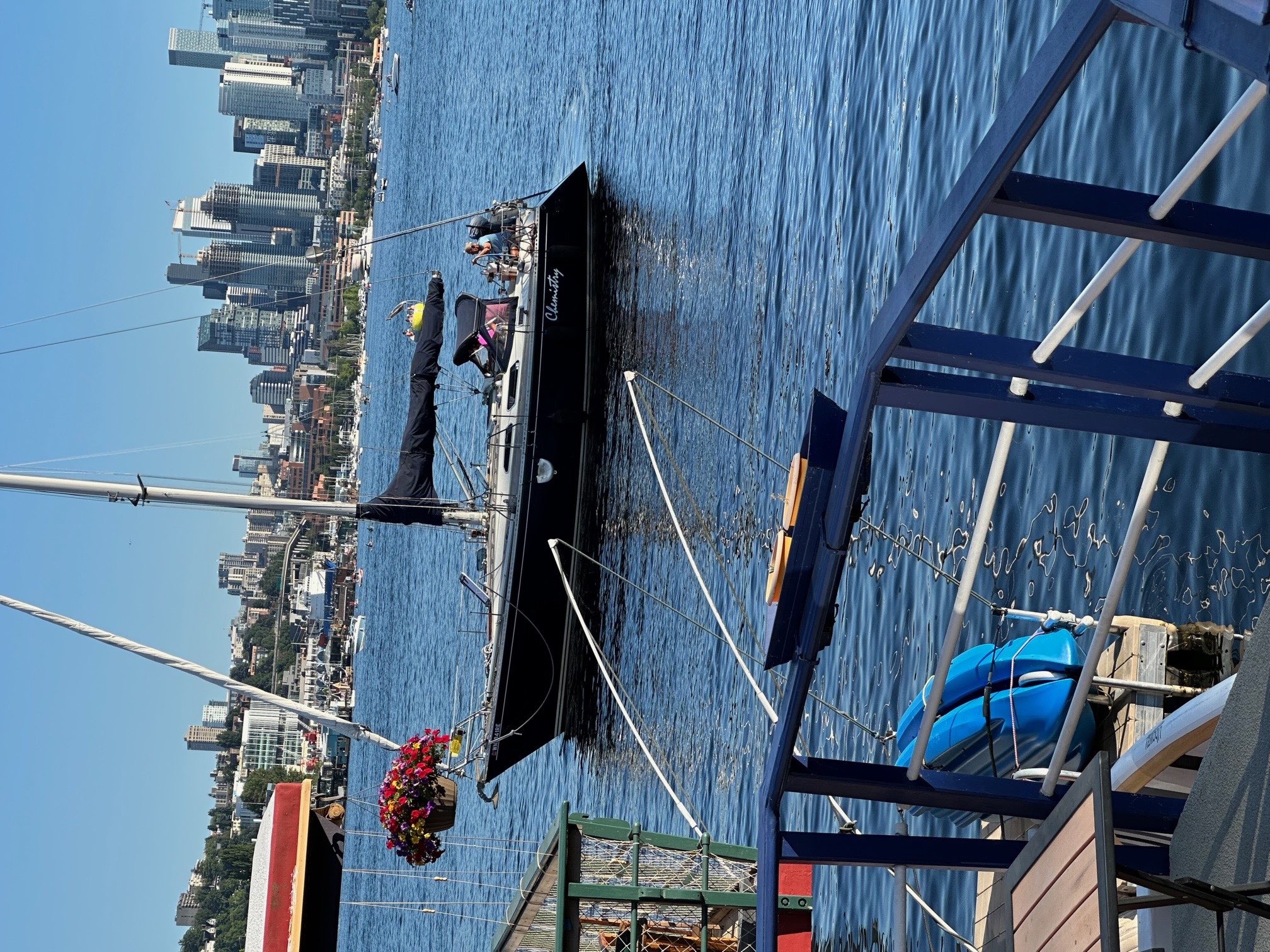 Sailboat passing by the marina